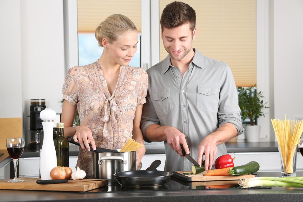image of a man and woman in the kitchen cooking